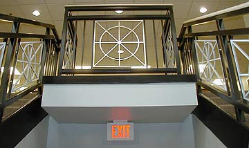 Art deco corridor with ornate metal ceiling panels
